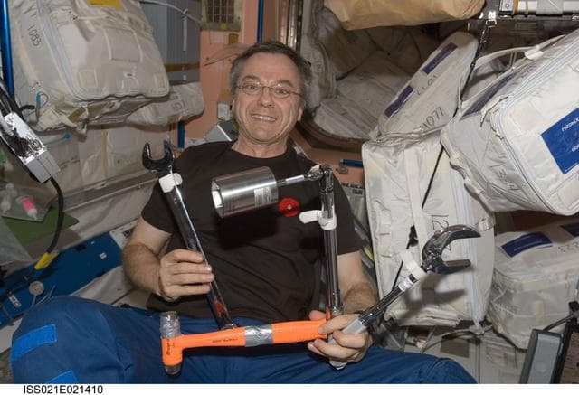 NASA image: View of FE Thirsk posing for a photo in the Node 1