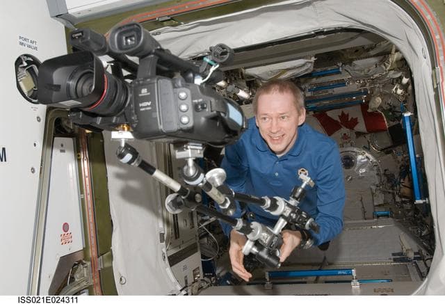 NASA image: Commander De Winne uses a Camcorder in the JPM