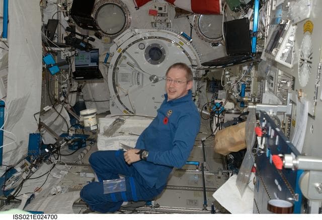 NASA image: Commander De Winne poses for a photo during Air Sampling