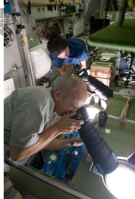 NASA image: Expedition 21 Crew Members take photos in the SM