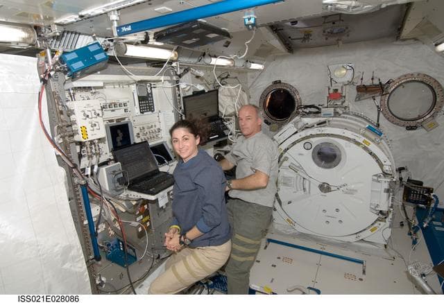 NASA image: Expedition 21 Crew Members pose for a photo in the JPM