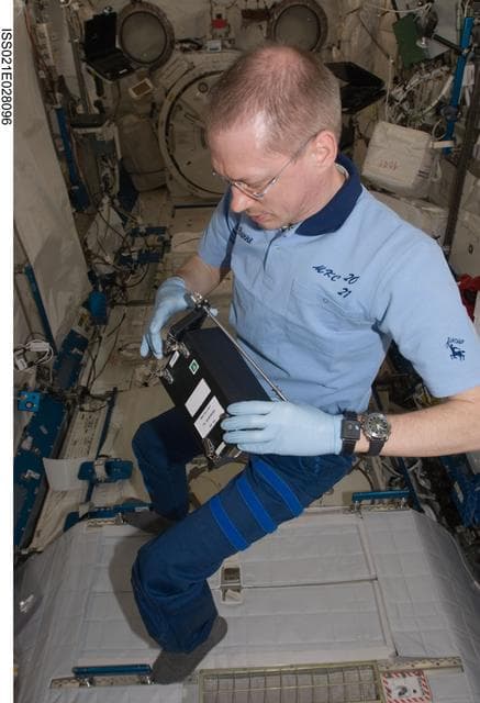 NASA image: Commander De Winne works on the RadSilk Experiment in the JPM