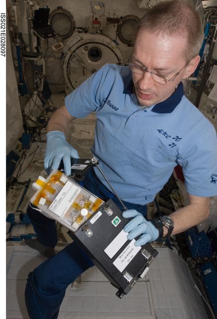 NASA image: Commander De Winne works on the RadSilk Experiment in the JPM