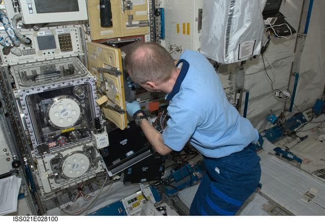NASA image: Commander De Winne works on the RadSilk Experiment in the JPM