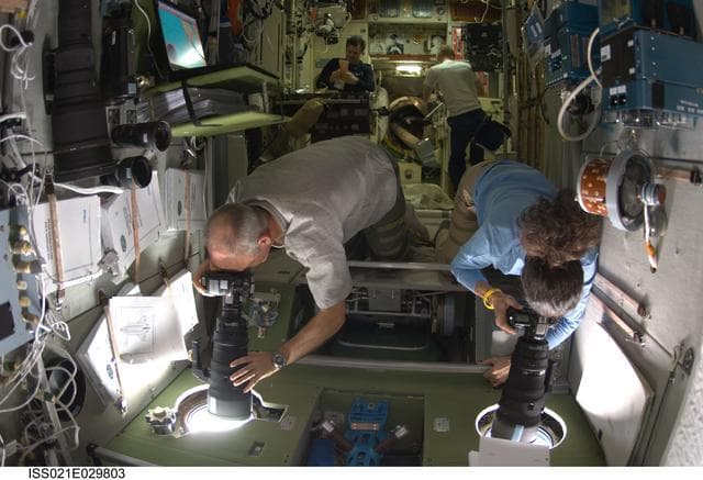 NASA image: Expedition 21 Crew Members take photos in the SM
