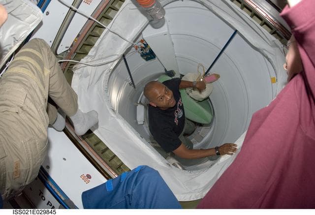 NASA image: STS-129 Crew Member boards the ISS after docking