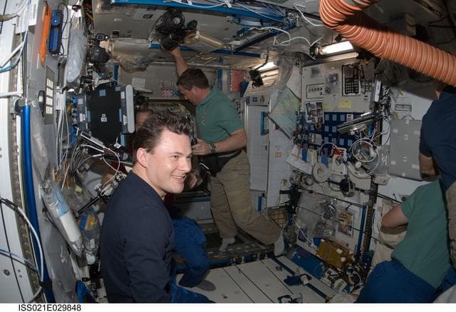 NASA image: STS-129 and Expedition 21 Crew Members greet one another