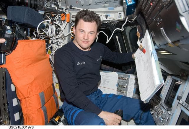 NASA image: Expedition 21 FE Romanenko poses for a photo on the Atlantis Flight Deck