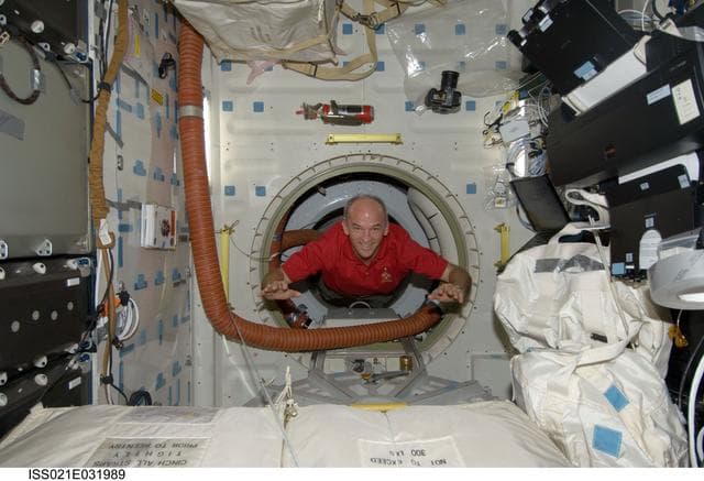 NASA image: Expedition 21 FE Williams poses for a photo on the Atlantis Middeck