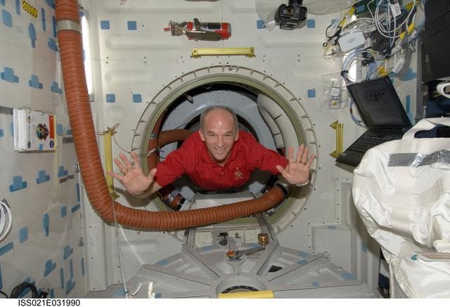 NASA image: Expedition 21 FE Williams poses for a photo on the Atlantis Middeck