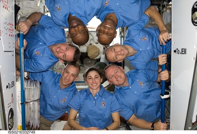NASA image: STS-129/Expedition 21 Crew Members pose for a photo in the US Lab