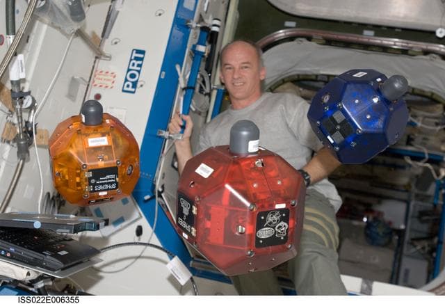NASA image: Williams works with SPHERES in the U.S. Laboratory during Expedition 22