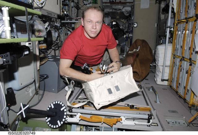 NASA image: Kotov looks through EVA Equipment in the SM during Expedition 22