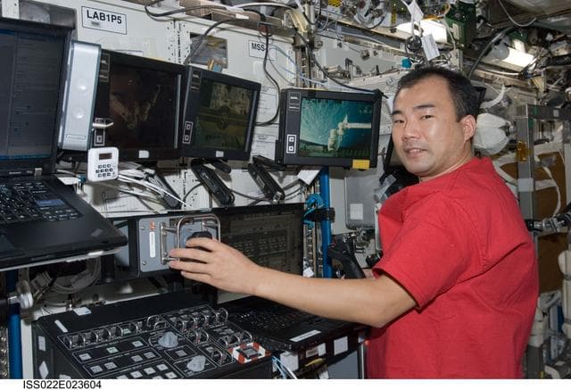 NASA image: Noguchi works at Canadarm2 Workstation in the U.S. Laboratory during Expedition 22