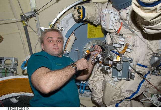 NASA image: Suraev works on Orlan-MK Suit in the Pirs DC-1 during Expedition 22