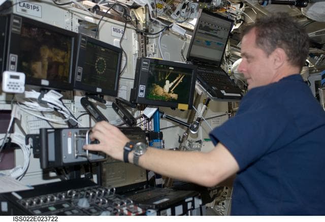 NASA image: Creamer at the SSRMS Canadarm2 Workstation in the U.S. Laboratory during Expedition 22