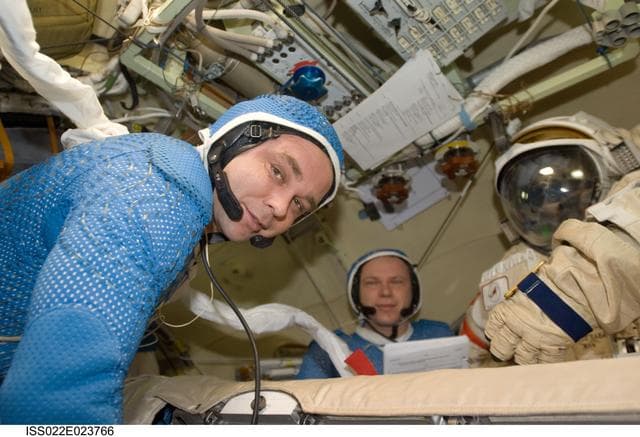 NASA image: Suraev and Kotov wearing LCVG in the Pirs DC-1 during Expedition 22