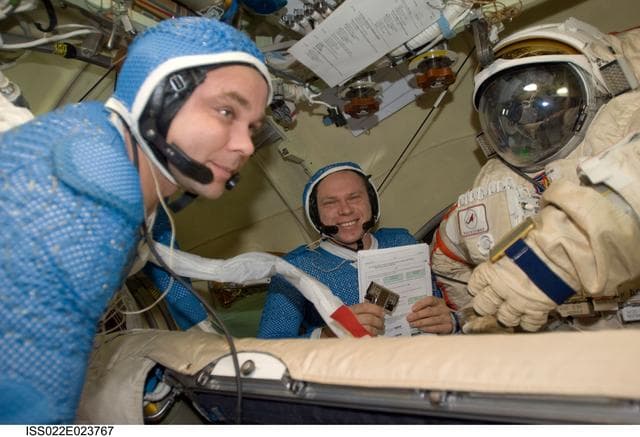 NASA image: Suraev and Kotov wearing LCVG in the Pirs DC-1 during Expedition 22