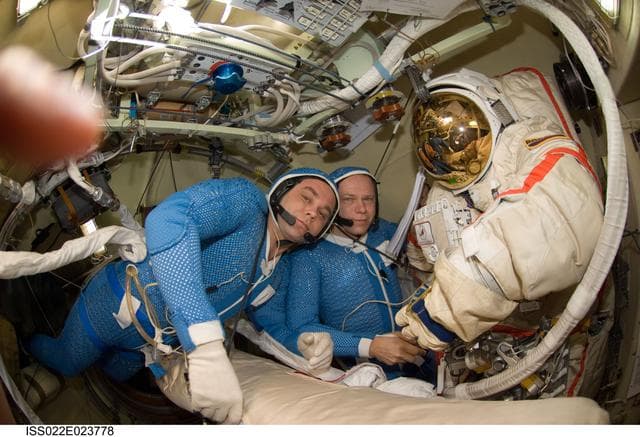 NASA image: Suraev and Kotov wearing LCVG in the Pirs DC-1 during Expedition 22