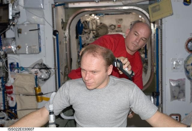 NASA image: Kotov receives haircut during Expedition 22
