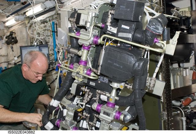 NASA image: Williams works on the CDRA IFM in the JPM during Expedition 22