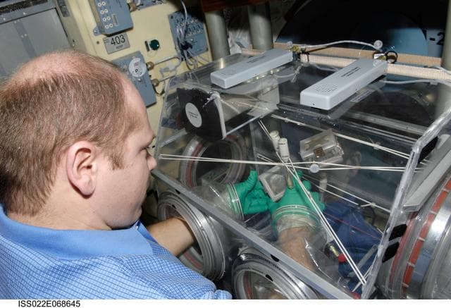 NASA image: Kotov works with samples from the Bioscience Experiment ASEPTIC during Joint Operations