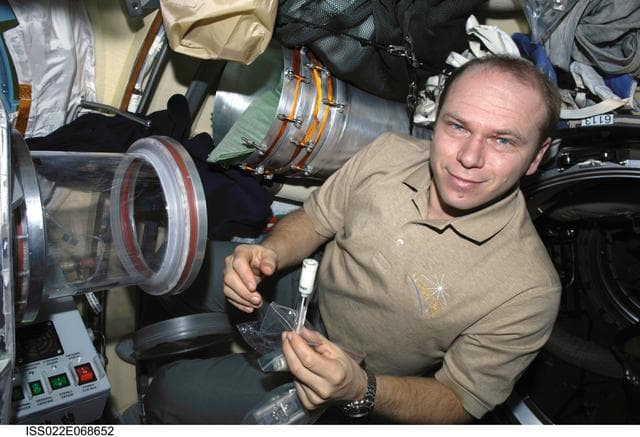 NASA image: Kotov works with samples from the Bioscience Experiment ASEPTIC during Joint Operations