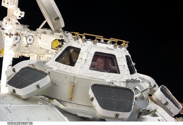 NASA image: Zamka at window in the Cupola Module during Joint Operations