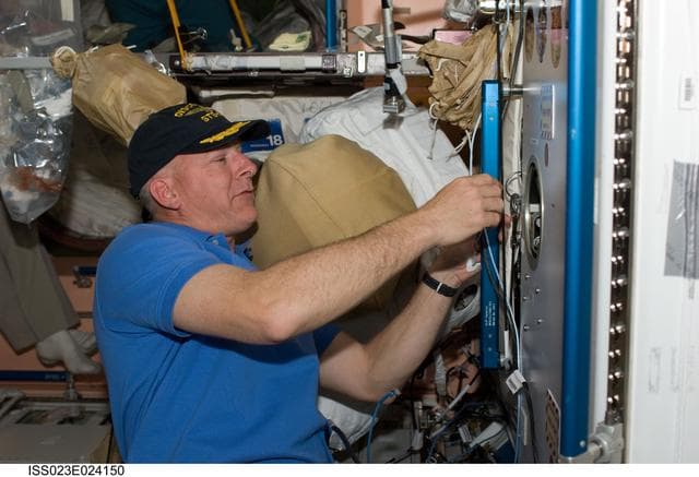 NASA image: Poindexter Places Mission Patch in Node 1