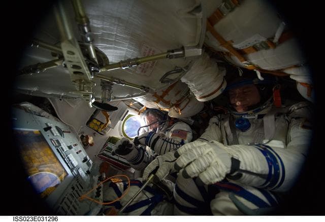 NASA image: Crewmembers in Soyuz TMA-17/21S during Sokol Suit Leak Check