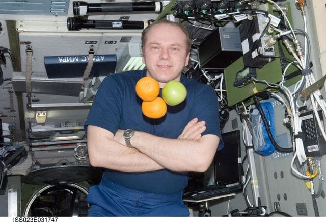 NASA image: Kotov with Fresh Fruit in the SM