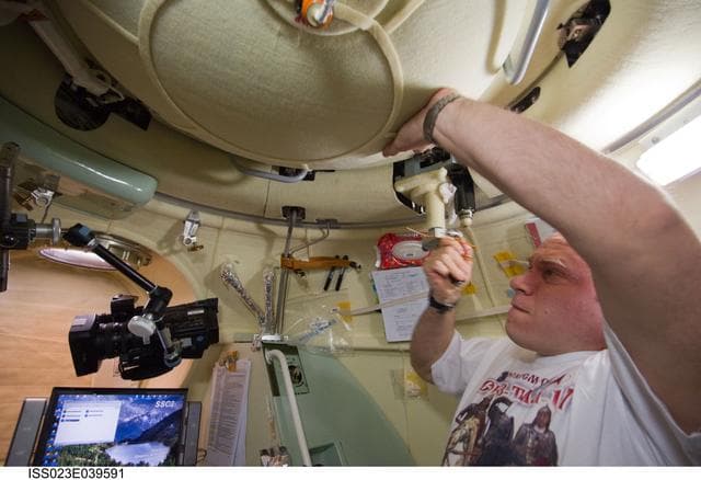 NASA image: Kotov closes Soyuz TMA-17/21S Hatch during Relocation Preparations