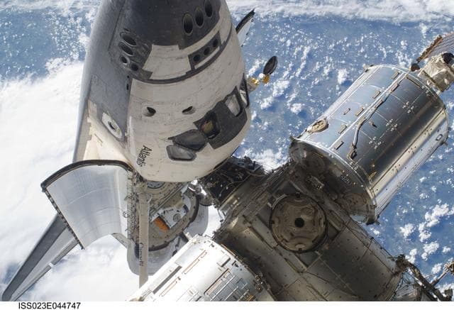 NASA image: View of the FWD ISS and docked Atlantis during EVA 1