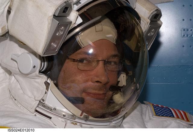 NASA image: FE Wheelock poses for a photo in her EMU