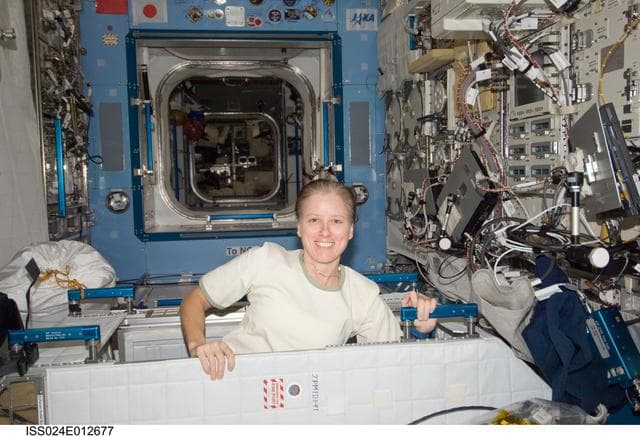 NASA image: FE Walker poses for a photo in her Crew Quarters