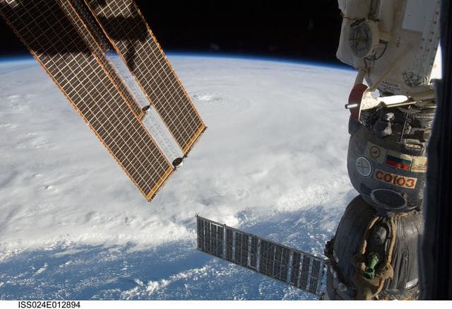 NASA image: View of Soyuz Spacecraft backdropped by Hurricane Earl