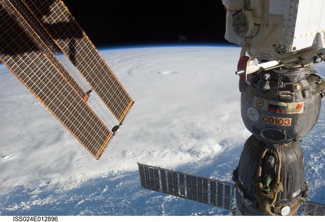 NASA image: View of Soyuz Spacecraft backdropped by Hurricane Earl