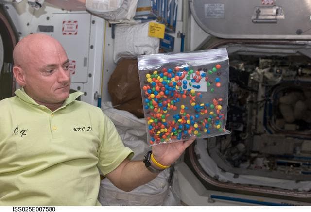 NASA image: Kelly in Node 1 with candy