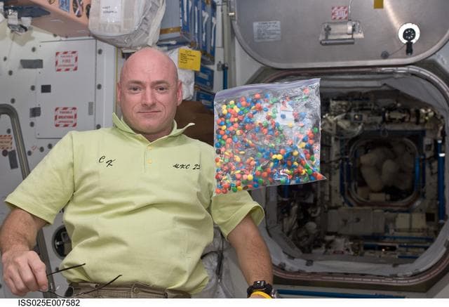 NASA image: Kelly in Node 1 with candy