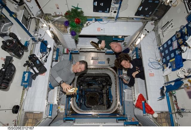NASA image: Expedition 26 Crewmembers in sleeping quarters