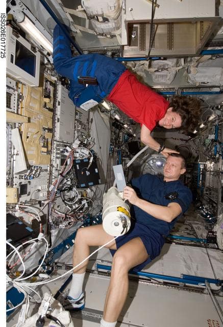 NASA image: Coleman cuts Kondratyev's hair in the JPM