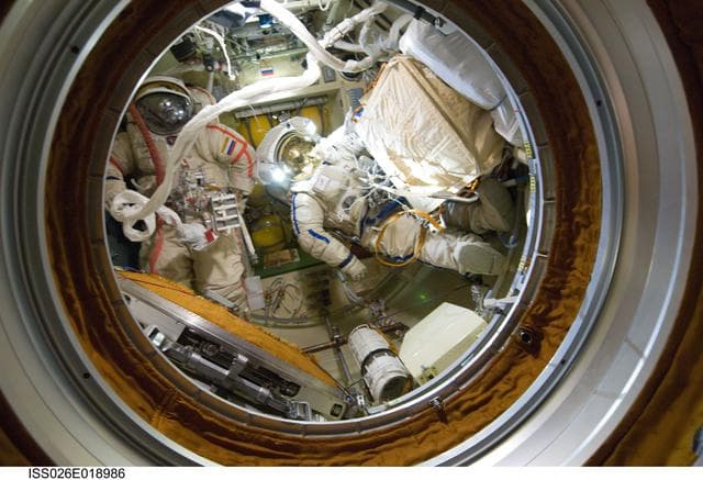 NASA image: Kondratyev and Shripochka after EVA
