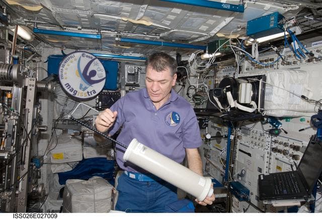 NASA image: Nespoli performs periodic maintenance on the PuFF Experiment