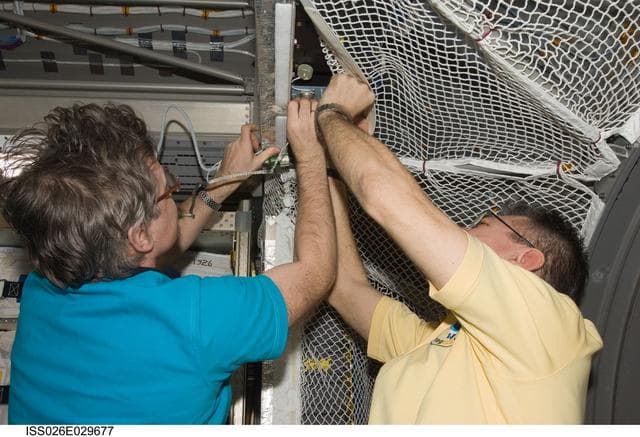 NASA image: Nespoli and Kaleri work in the ATV 2