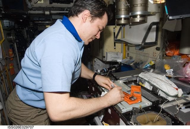 NASA image: Skripochka labels surface sampling tubes