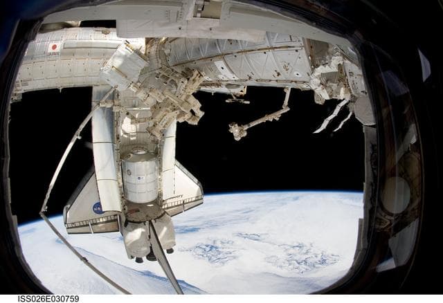 NASA image: STS-133 Space Shuttle Discovery and DEXTRE