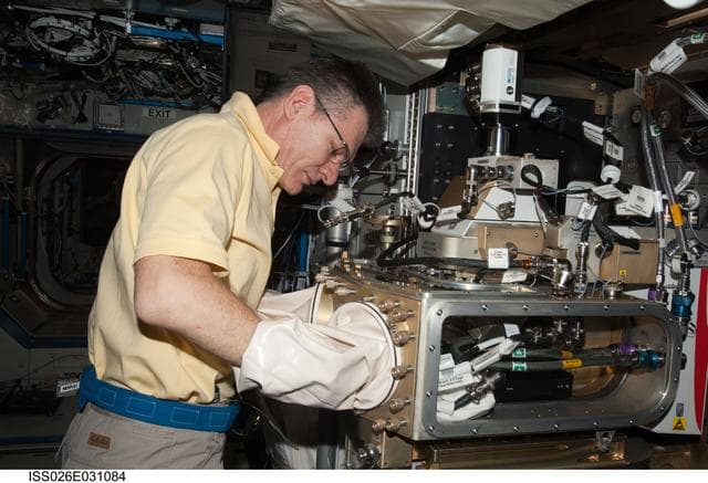 NASA image: Nespoli works with the LMM Spindle Bracket Assembly in the FIR
