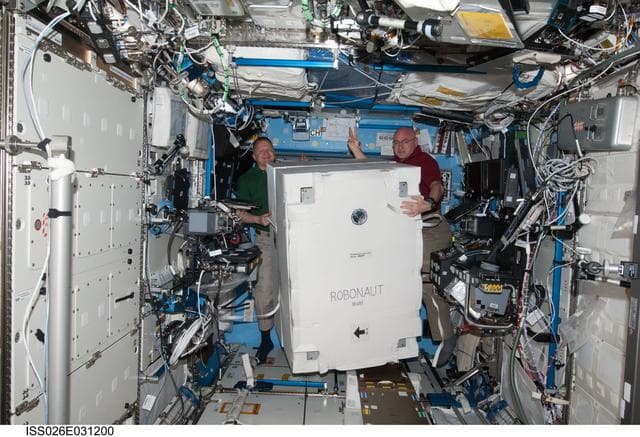 NASA image: Boe and Kelly move Robonaut2 Container