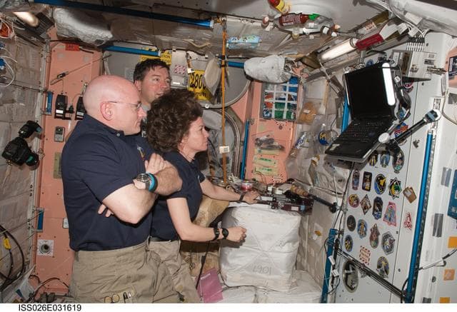 NASA image: Expedition 26 and STS-133 Crewmembers watching monitor