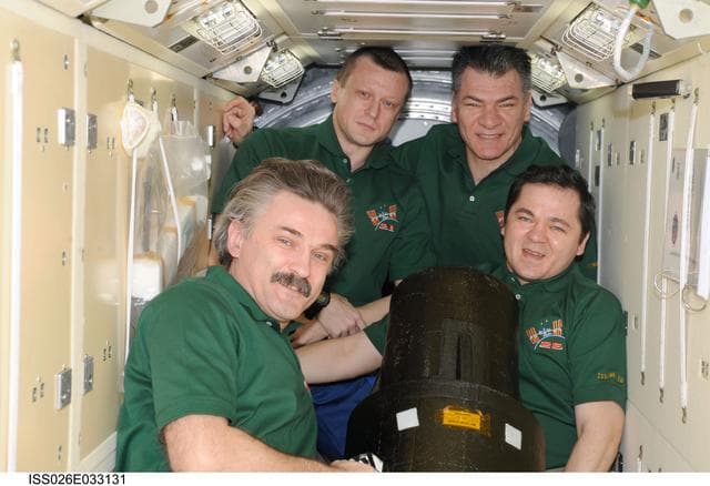 NASA image: Expedition 26 Crewmembers pose with European Matroshka-R Phantom Experiment